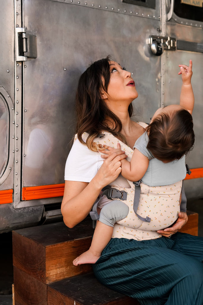 Beco Baby Carrier in Sprinkles pattern - shown with toddler in the front carry position