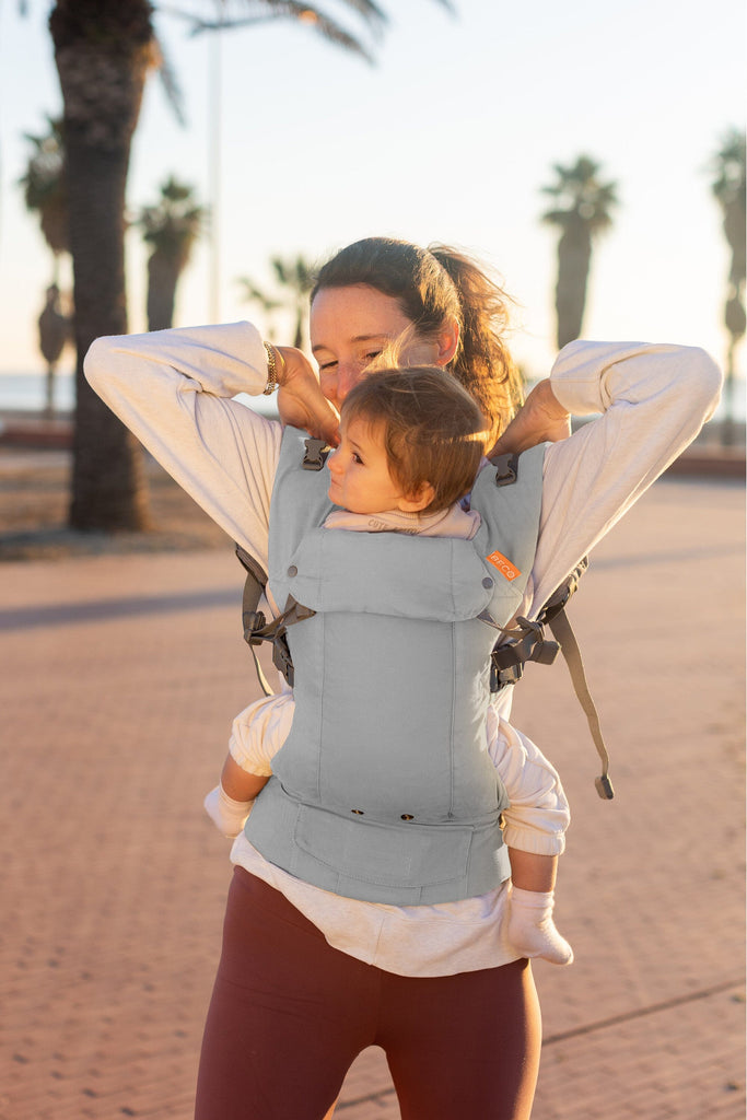 Baby in the Beco Gemini Baby Carrier in Grey