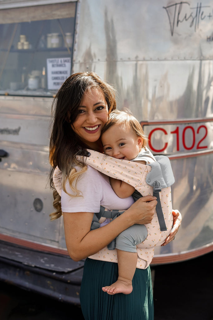 Beco Baby Carrier in Sprinkles pattern - shown with toddler in the front carry position