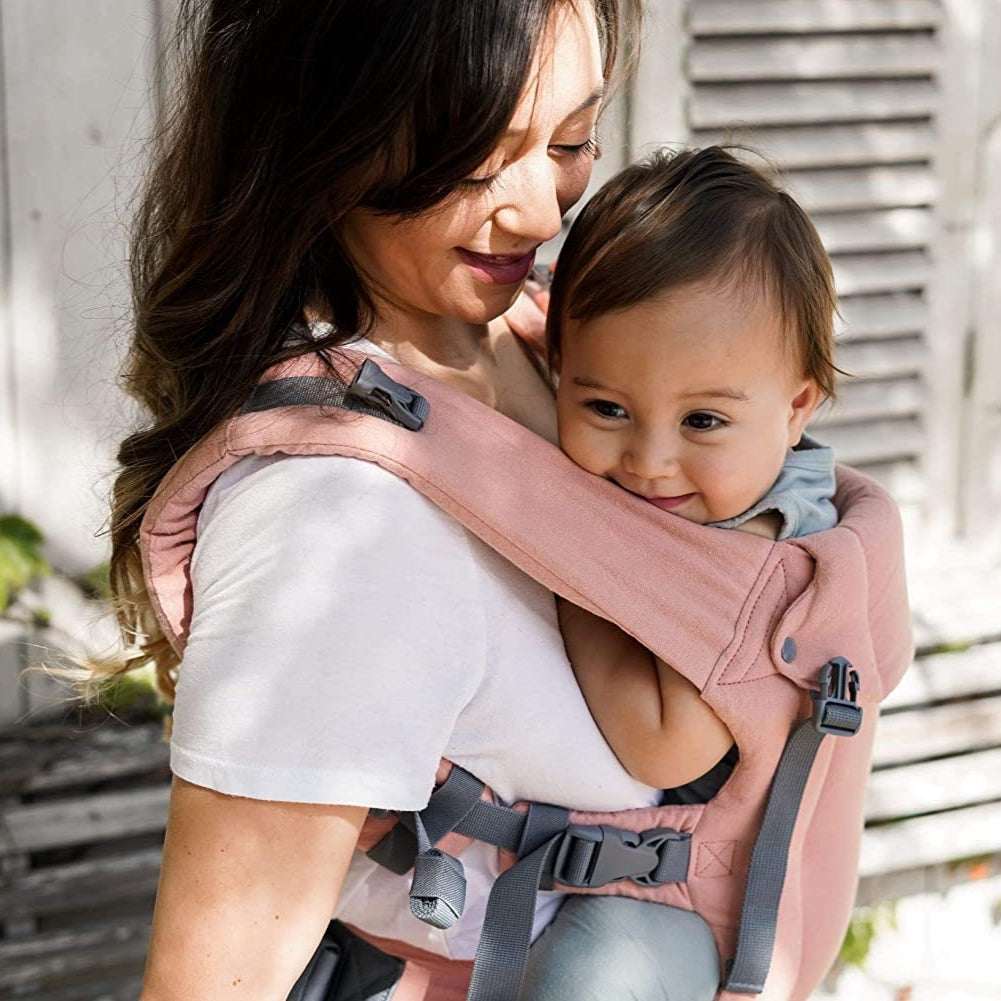 Baby in Beco Gemini baby carrier in pink linen