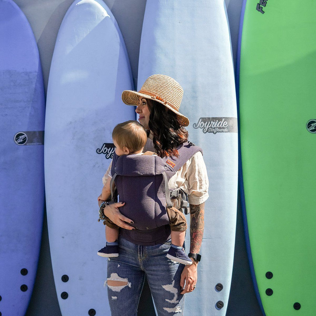 Baby in front carry in the Beco Gemini Baby Carrier in Blue Linen