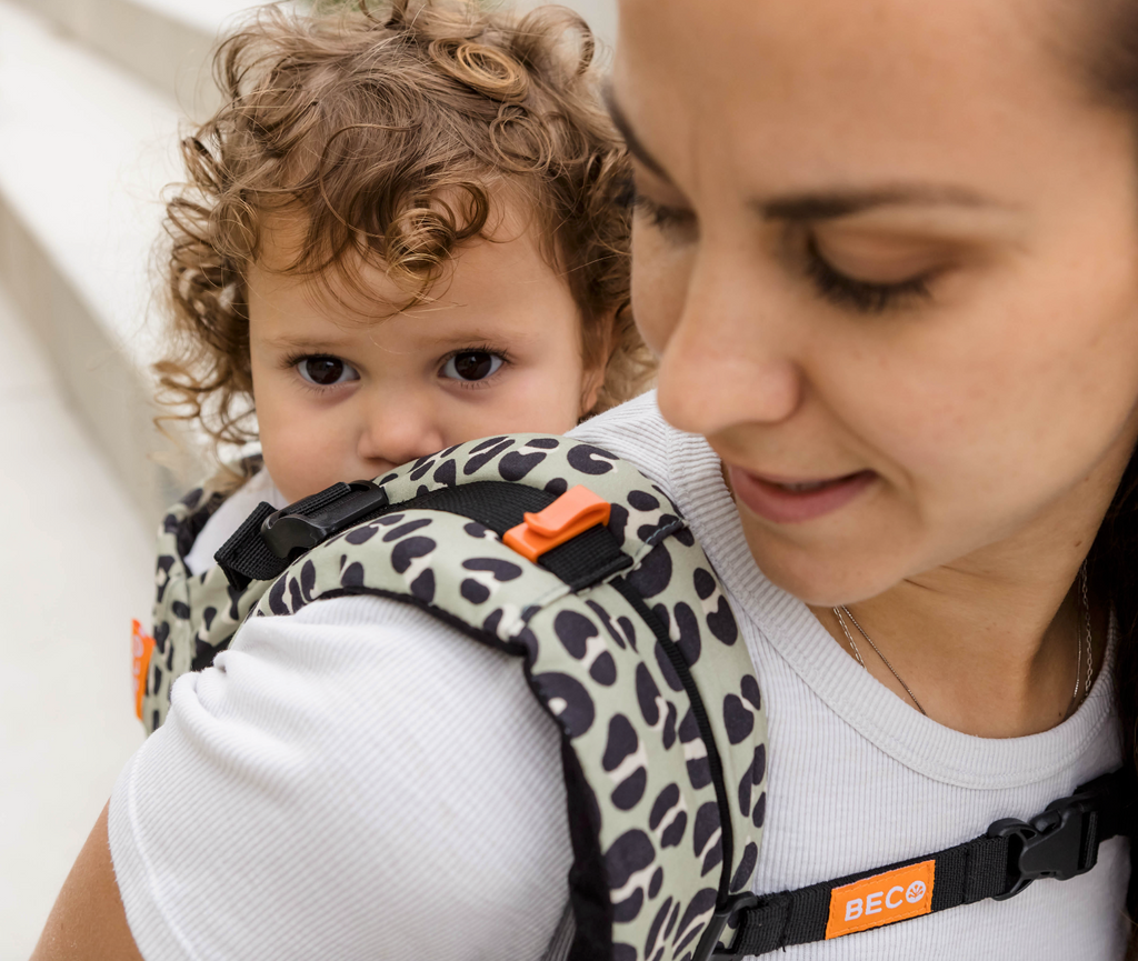 Toddler in back carry Beco Gemini in jade leopard