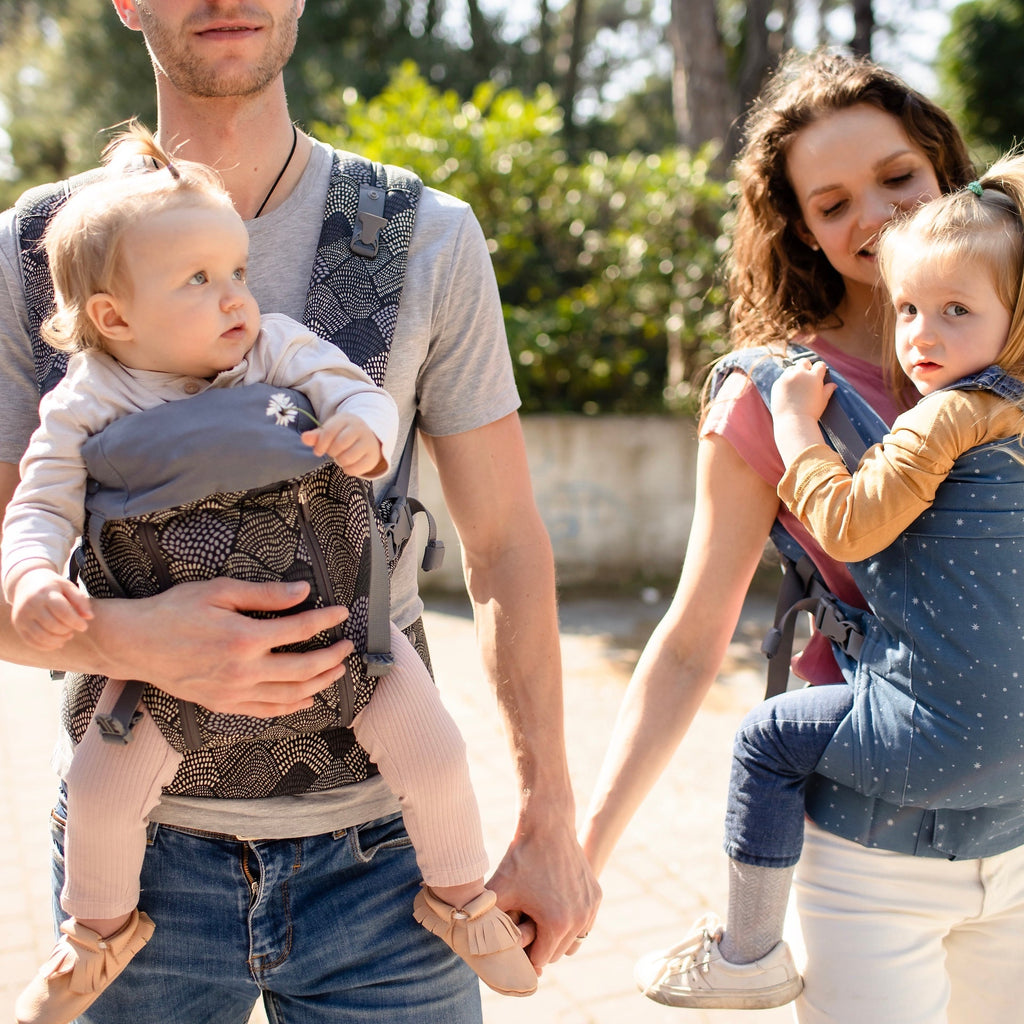 Beco Toddler Carrier in Moonlight Stardust pattern, shown with toddler in the front carry position